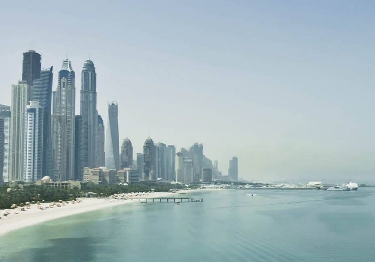 Dubai, chastened but determined