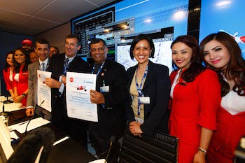 All smiles at the signing ceremony (L-R): Airbus' Didier Lux, with AirAsia's Tony Fernandes and Aireen Omar.