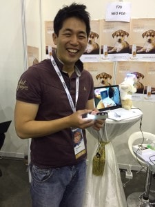 NeoPop's Seo Young Jin showing off his invention, a bling bling smart dog collar