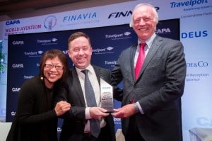 Alan Joyce accepting the two awards from Peter Harbison, executive chairman of CAPA, in Helsinki