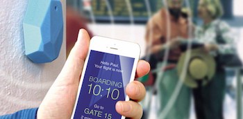 More than 80% of travellers carry smartphones. (Image credit - hand holding smartphone: SITA)
