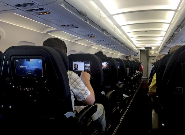 More passengers prefer to have IFE on a personal device than the aircraft’s seat back screen. (Image credit: chameleonseye/iStock)