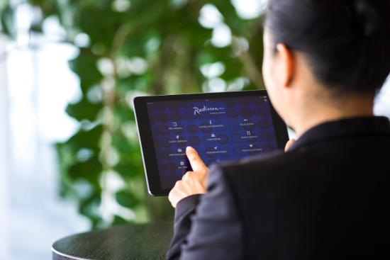 Carlson Rezidor the is first hotel group to implement solution via Radisson Blu One Touch app. (Image credit: TripAdvisor)